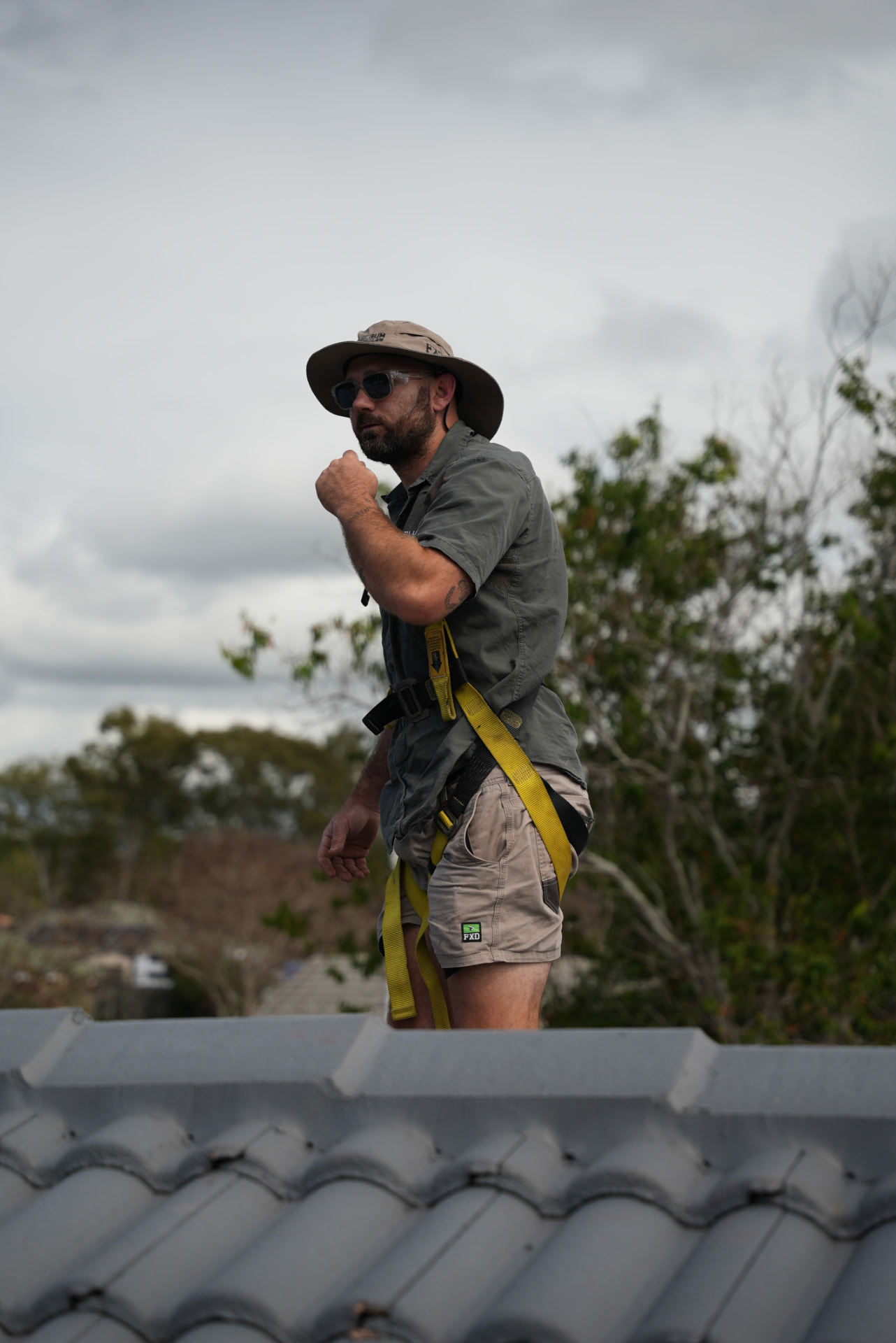QLD Blue Gum Renewables installer wearing roof safety equipment during an installation